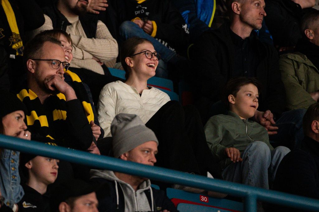 Princess Estelle and Prince Gabriel smiling while watching a hockey match