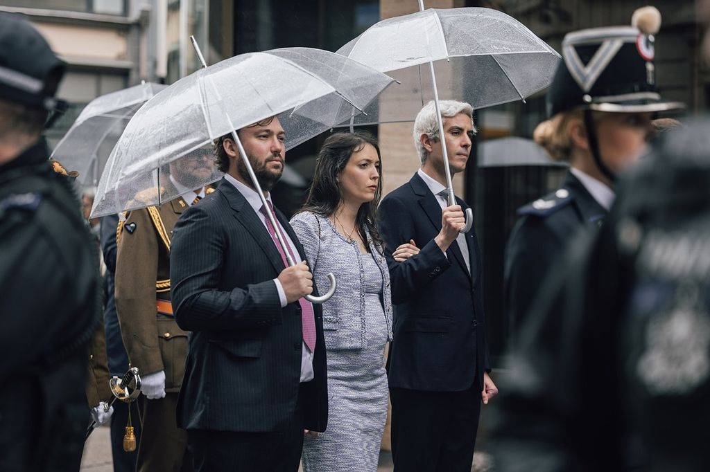 Princess Alexandra of Luxembourg stands in the rain
