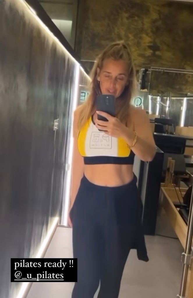 Louise Redknapp poses for a selfie in a lycra workout outfit