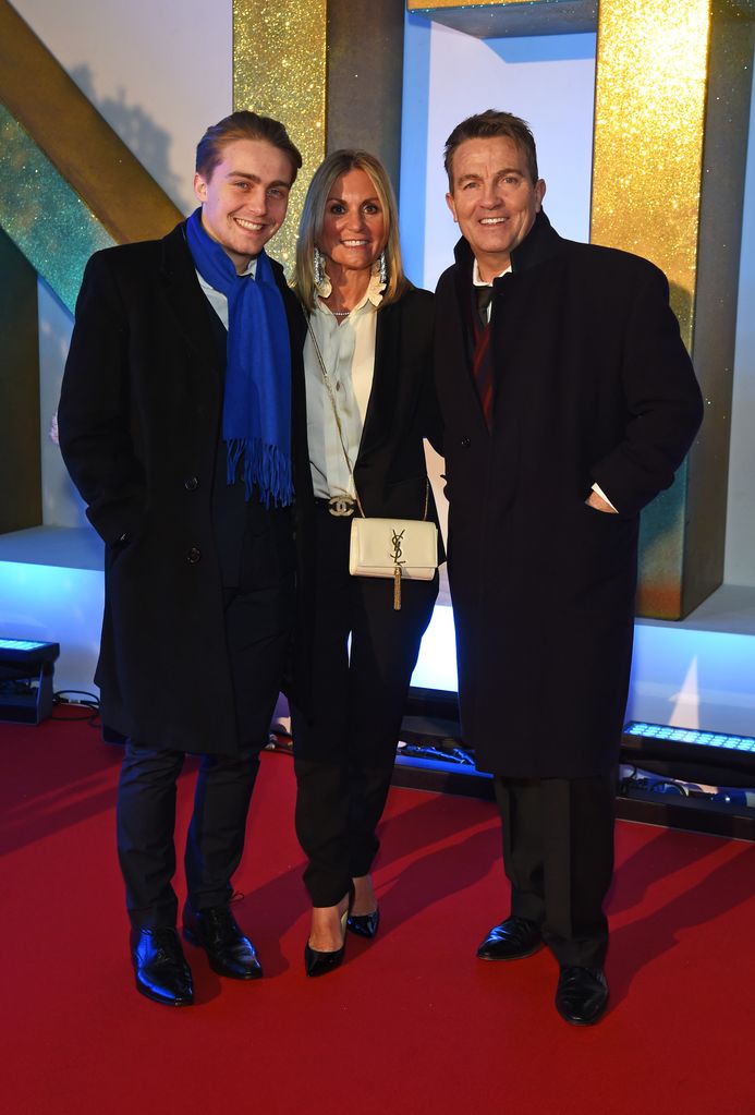 Barney Walsh standing with parents Donna Derby and Bradley Walsh