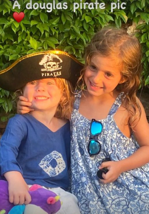 Two young children, one in a pirate's hat