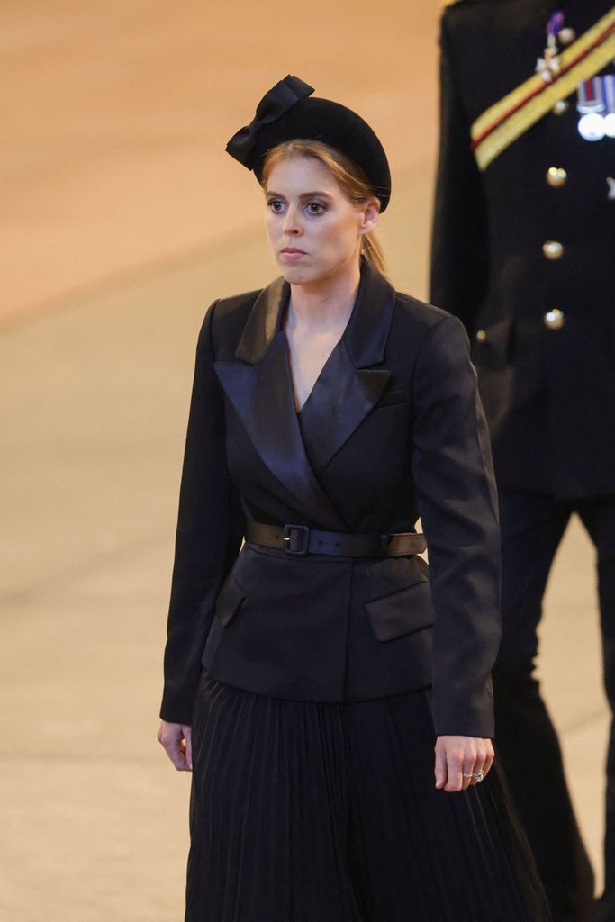 Britain's Princess Beatrice of York leaves ahaving held a vigil at the coffin of Queen Elizabeth II, in Westminster Hall, at the Palace of Westminster in London on September 17, 2022, ahead of her funeral