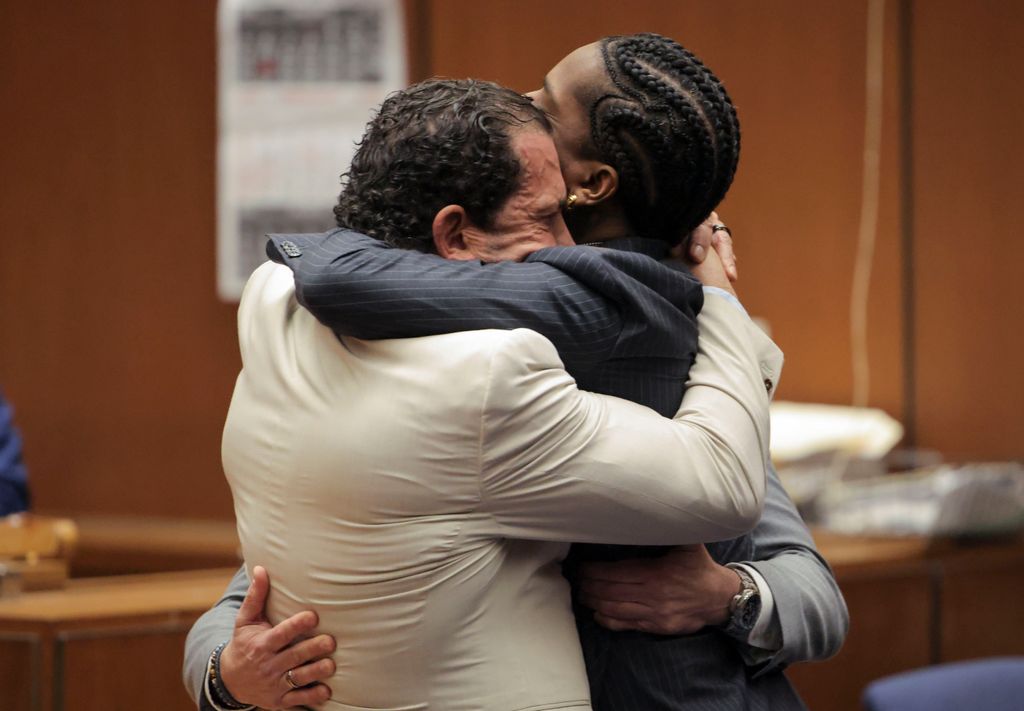 The rapper embraced his lawyer after the verdict was read