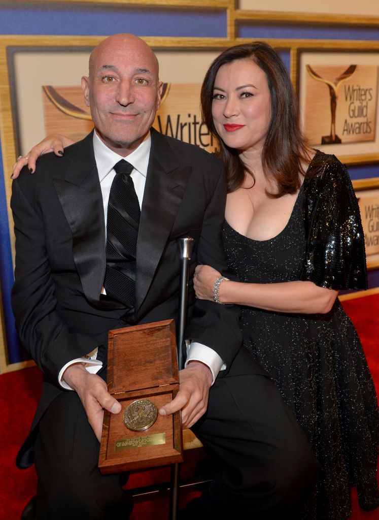 Sam Simon, winner of the"Valentine Davies Award for Humanitarian Efforts and Community Service" and actress Jennifer Tilly pose in the press room at the 2014 Writers Guild Awards L.A. Ceremony at J.W. Marriott at L.A. Live on February 1, 2014 in Los Angeles, California