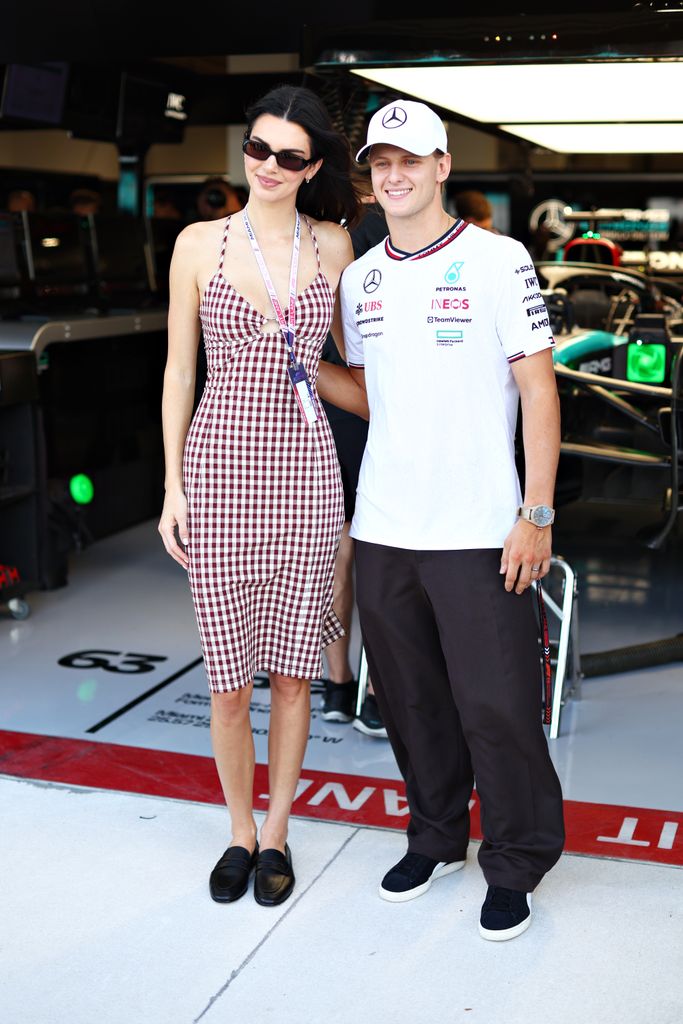 Kendall Jenner and Mick Schumacher of Germany, Reserve Driver of Mercedes pose for a photo in the Mercedes garage during practice prior to Round 2 Miami of the F1 Academy at Miami International Autodrome on May 03, 2024 in Miami, Florida. (Photo by Clive Rose - Formula 1/Formula 1 via Getty Images)