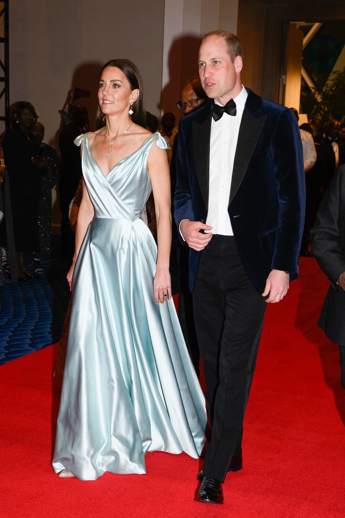 Prince William and Catherine on red carpet in satin gown