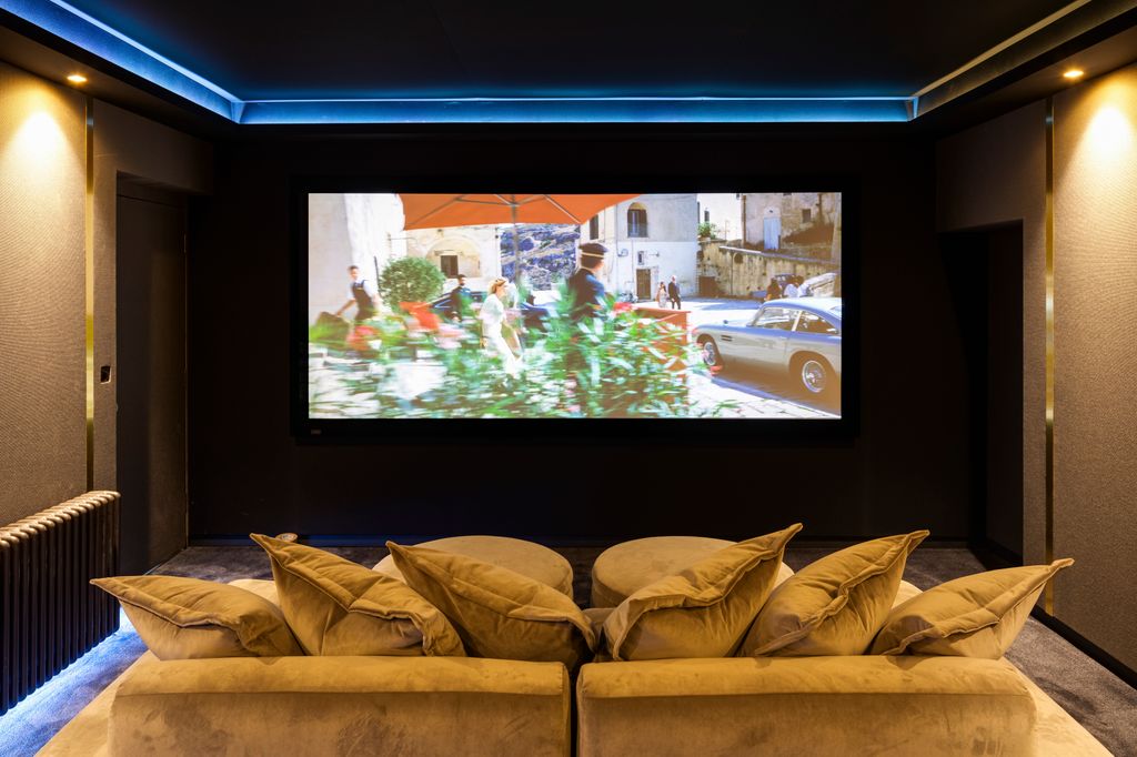 Sink into the cinema room's plush sofas for an evening of entertainment