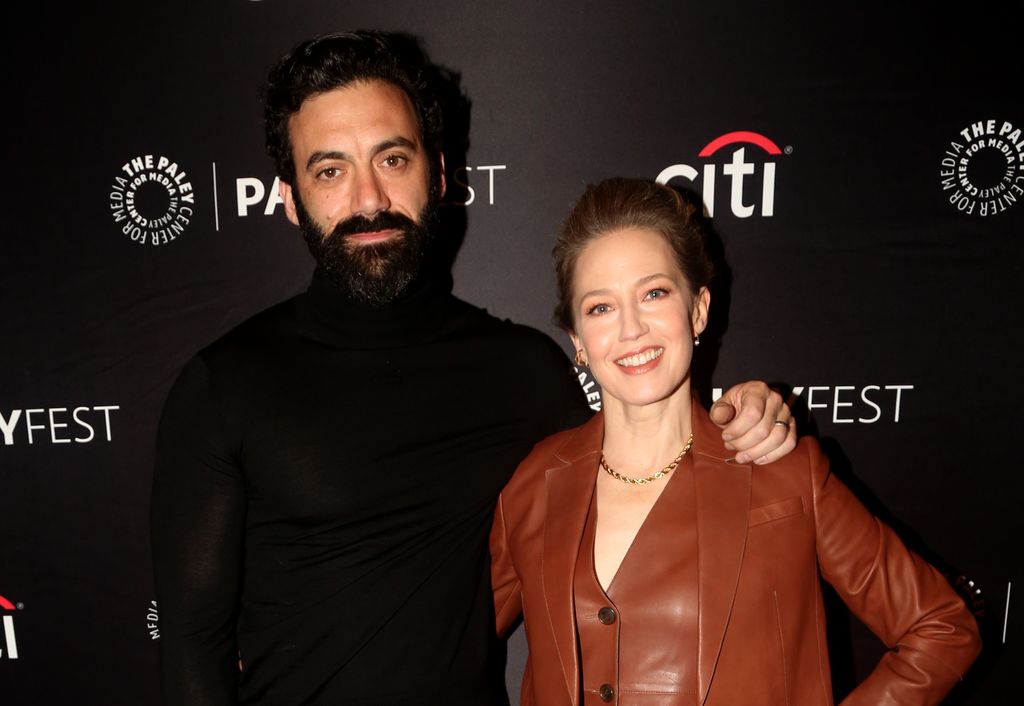 Morgan Spector and Carrie Coon pose at PaleyFest in 2022