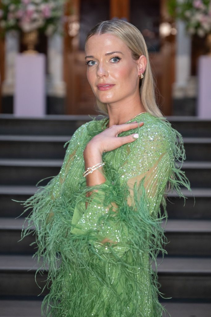 Lady Eliza Spencer modelling gold jewellery in green dress