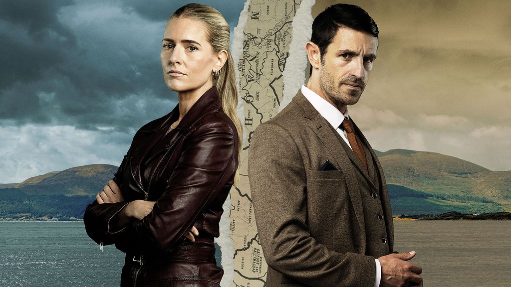 woman and man posing against coastal background