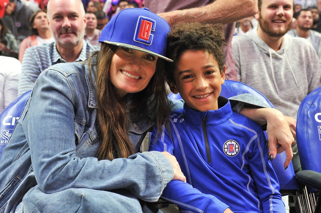 Idina Menzel and Walker Nathaniel Diggs attend a basketball game between the Los Angeles Clippers and the Charlotte Hornets at Staples Center on October 28, 2019 in Los Angeles, California