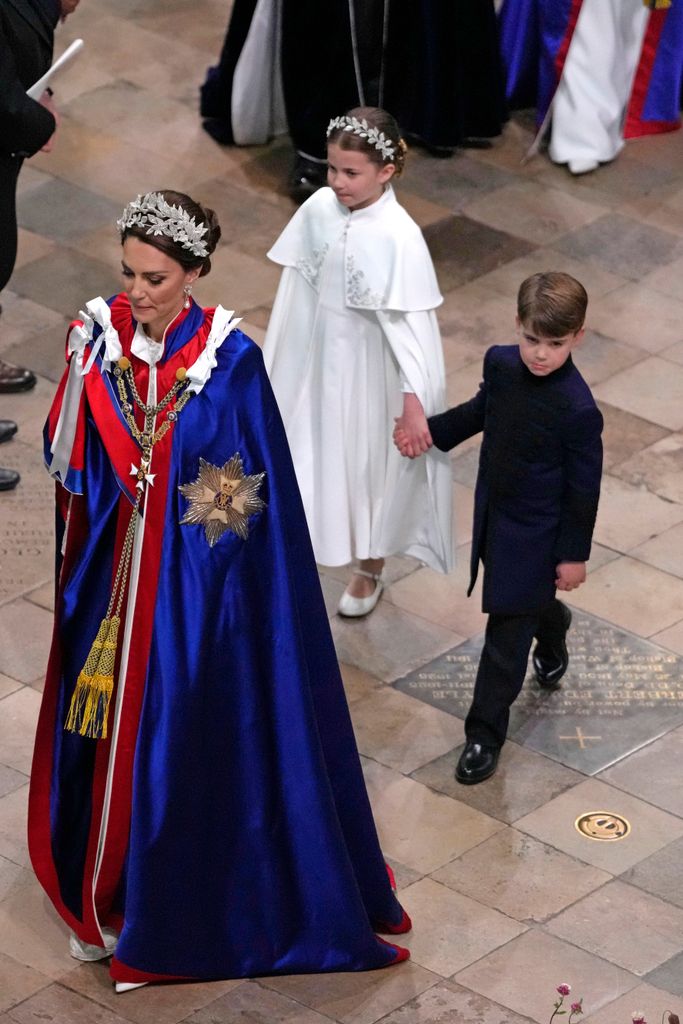 Princess Kate walking with Princess Charlotte and Prince Louis at the coronation