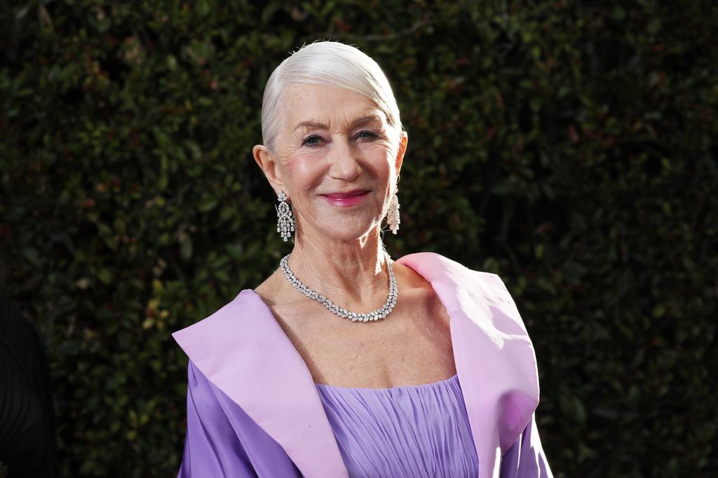 woman in purple dress smiling for camera