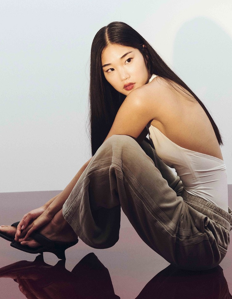asian model in jeans and tank top and heels