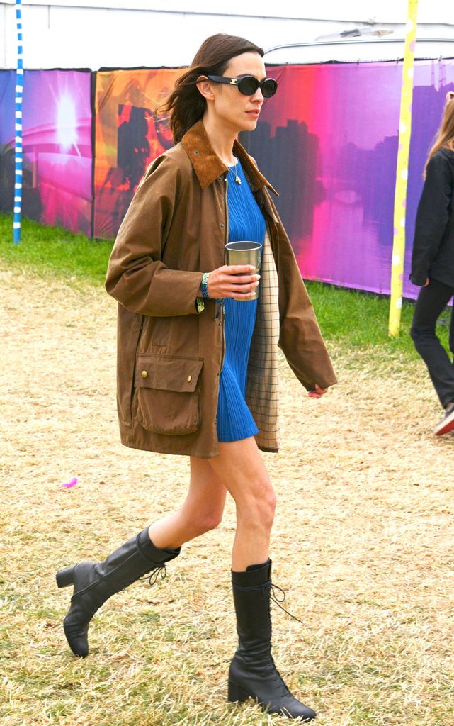 Alexa Chung is seen on day one of Glastonbury festival wearing her vintage Barbour jacket 