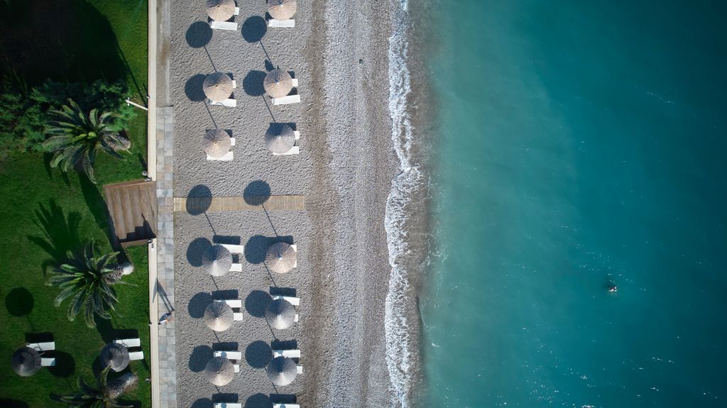 an aerial view of the beach at The Ixian Grand & All Suites.