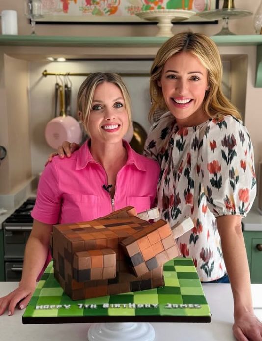 Cat Deeley and a chef with an illusion cake in the shape of a cooked chicken from the game Minecraft