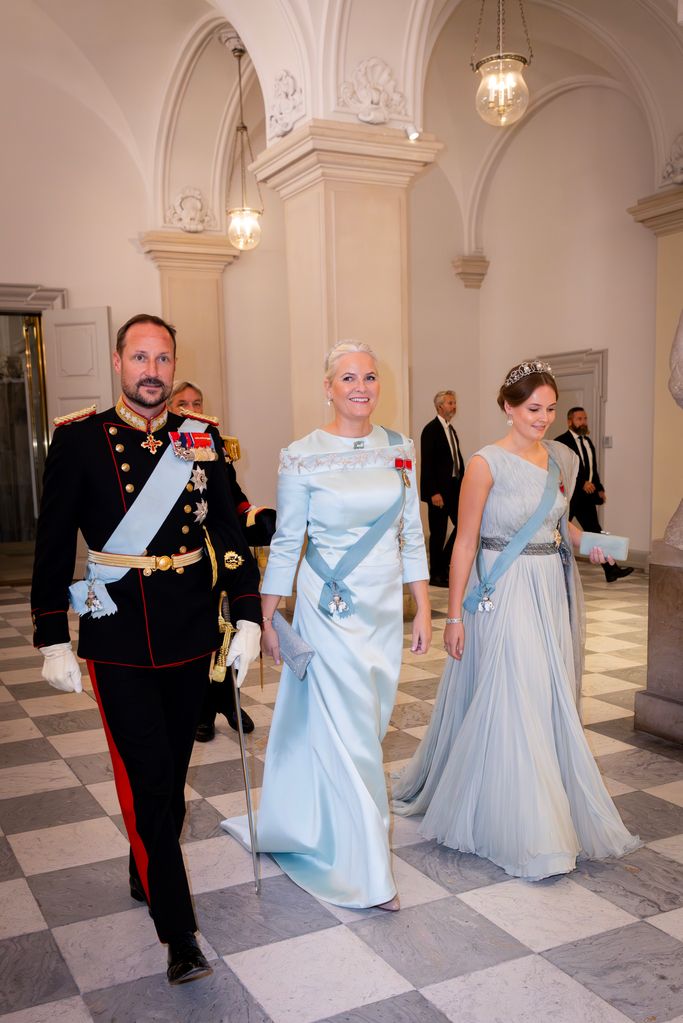 Crown Princess Mette-Marit of Norway in blue dress with Prince Haakon and Princess Ingrid