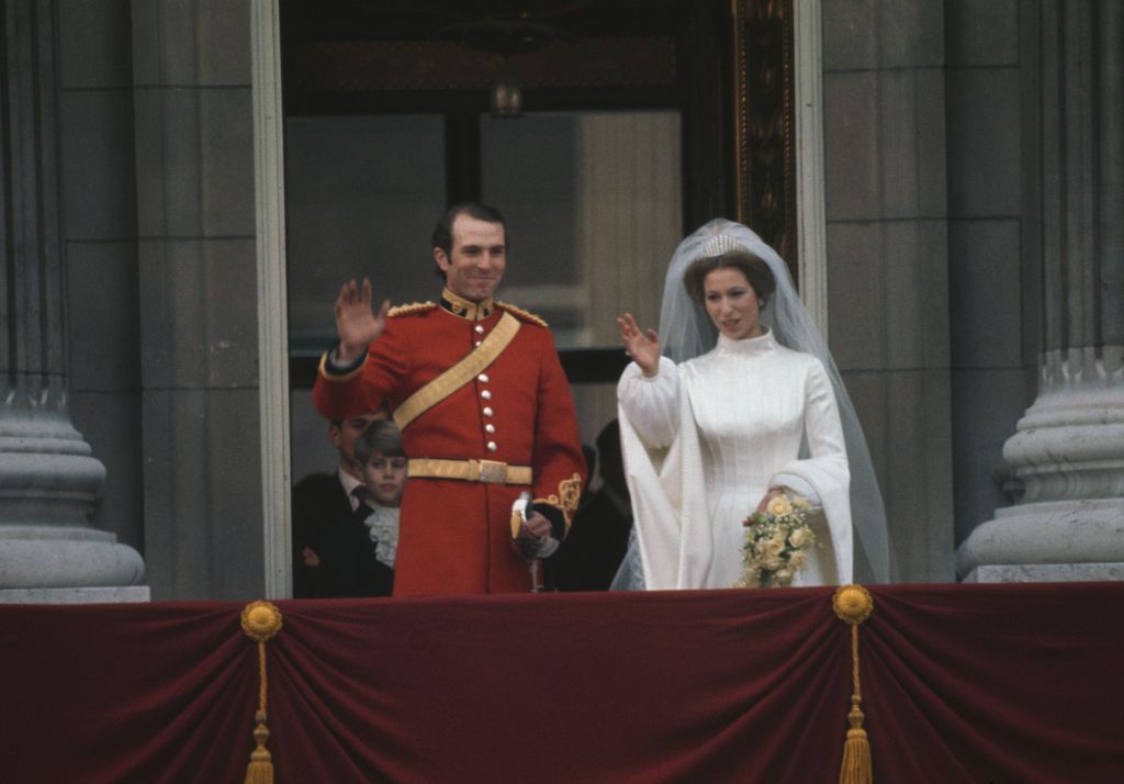 Captain Mark Phillips and Princess Anne wave from balcony