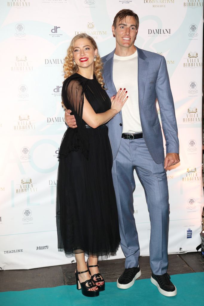Amber Heard and Conor Allyn attend the 69th Taormina Film Festival on June 24, 2023 in Taormina, Italy.