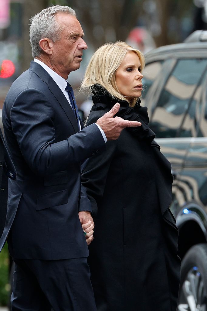 Robert F. Kennedy Jr. and his wife Cheryl Hines arrive at his mother Ethel Kennedy's celebration of life at the Cathedral of Saint Matthew on October 16, 2024 in Washington, DC