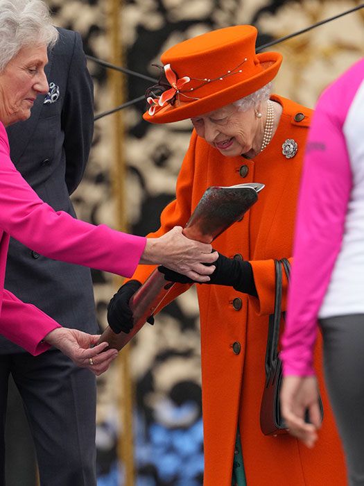 queen hands over baton