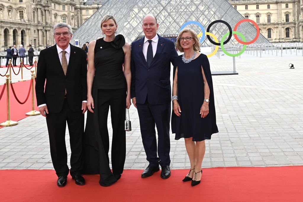 President of the International Olympic Committee (IOC) Thomas Bach (L) and his wife Claudia Bach (R) pose with Prince Albert II of Monaco and his wife Charlene, Princess of Monaco