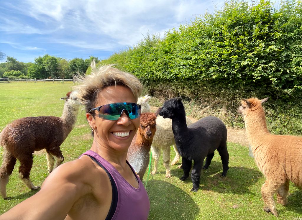 Kelly Holmes poses with her alpacas