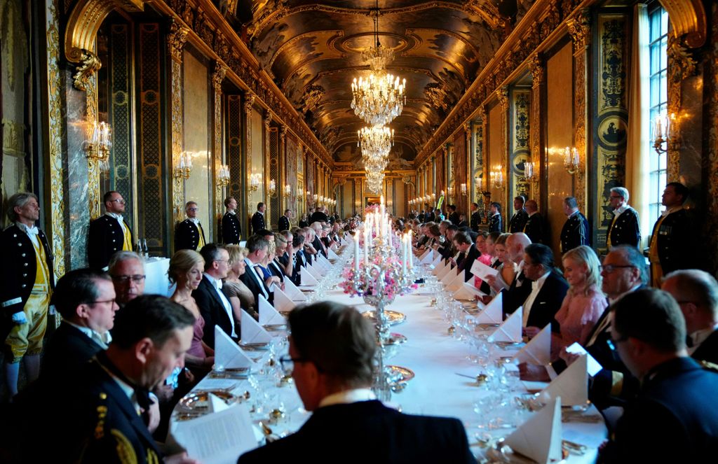 Guests attend a banquet at Stockholm Palace in Stockholm