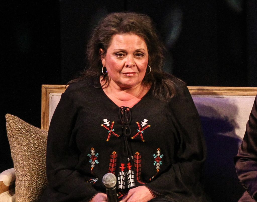 photo of kathy cash sitting on couch