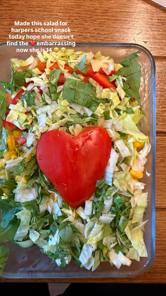 A photo of a salad with a heart-shaped pepper