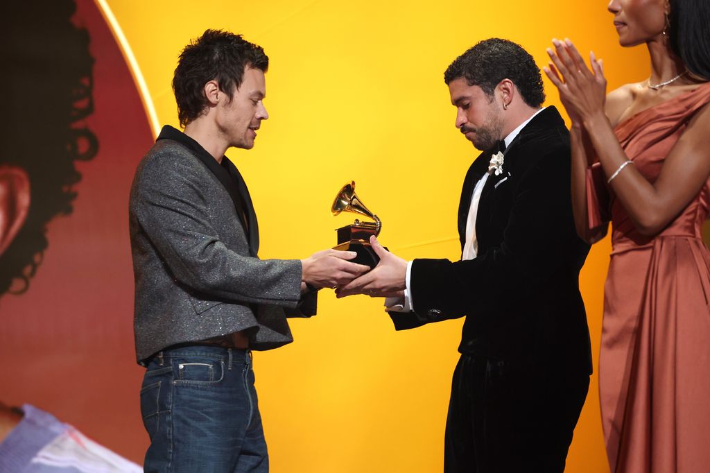 Harry Styles presents the Album of the Year award to Bad Bunny for "DeBÃ TiRAR MÃ¡S FOToS" onstage during the 68th GRAMMY Awards at Crypto.com Arena on February 01, 2026 in Los Angeles, California