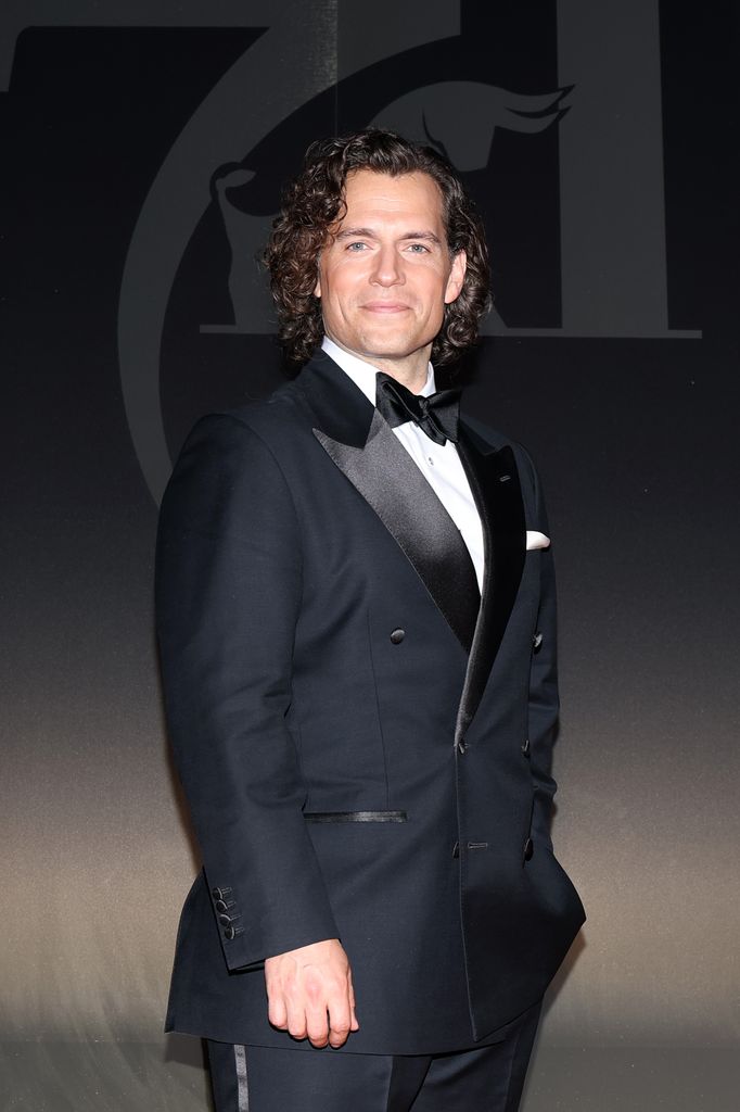 henry cavill in tux with long curly hair