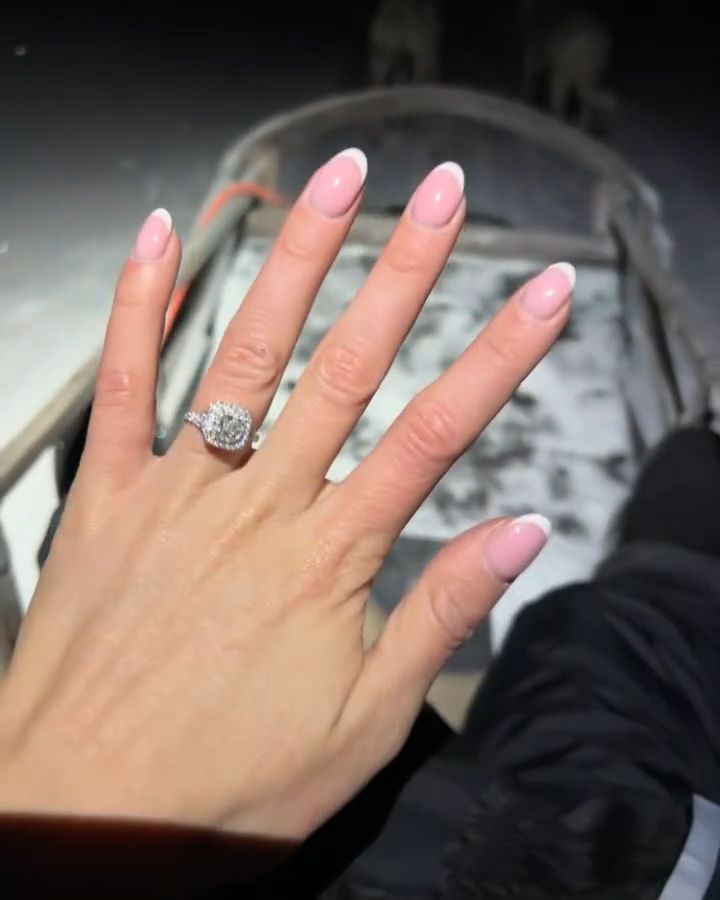 Chloe Kelly's halo diamond engagement ring on a husky ride