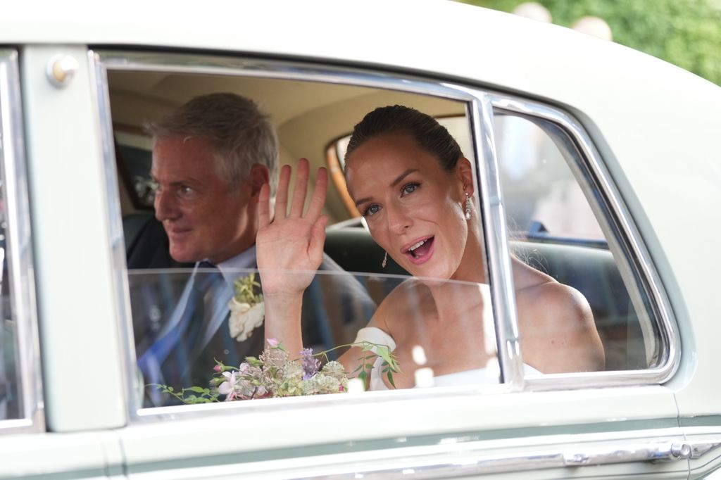 Zac Goldsmith and Hum Fleming in wedding car as they wave goodbye to their guests