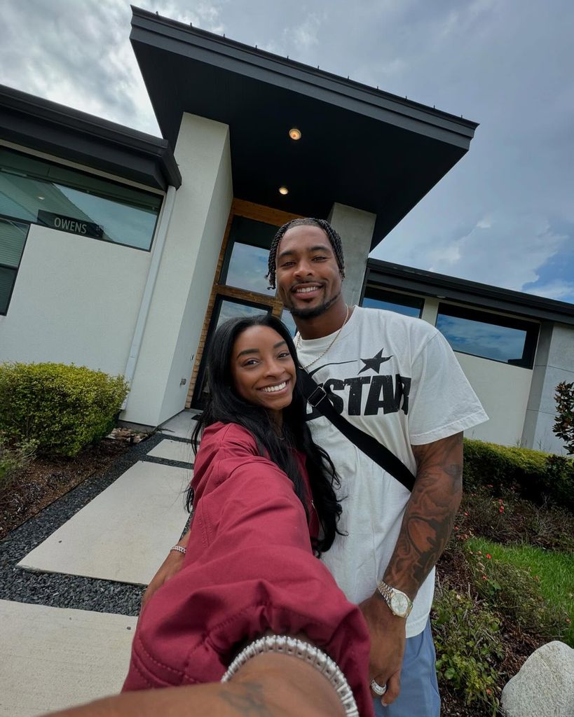 simone biles and jonathan owens standing outside texas home
