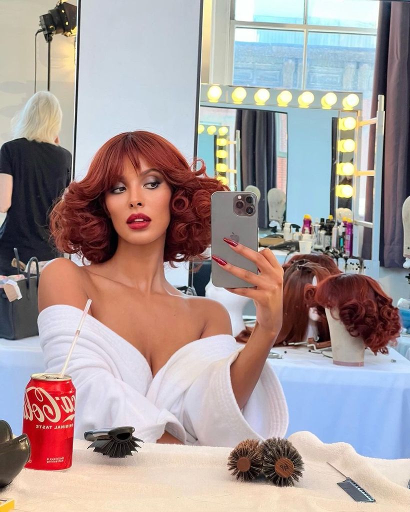 Maya Jama takes a mirror selfie with red hair