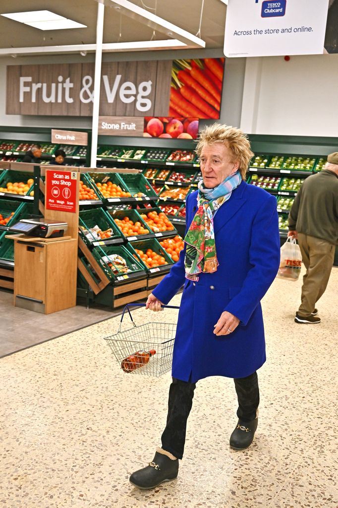 Sir Rod Stewart visits his local Tesco in Bishop's Stortford to celebrate Wolfie's Whisky now being available to buy in more than 400 Tesco stores across the UK on January 30, 2024 in London, England.