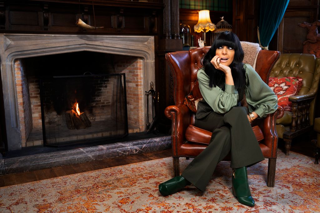 Claudia Winkleman wearing a green striped blouse, waistcoat, trousers and green boots on 2026 first episode of The Traitors