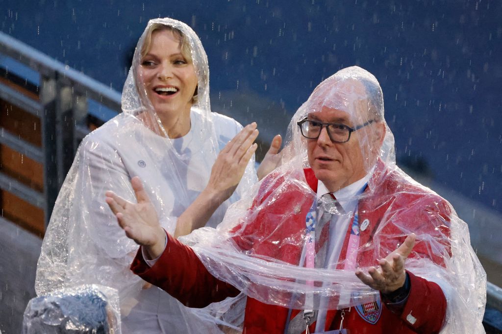 Prince Albert II of Monaco (R) and Princess Charlene of Monaco attend the opening ceremony of the Paris 2024 Olympic Games in Paris on July 26, 2024