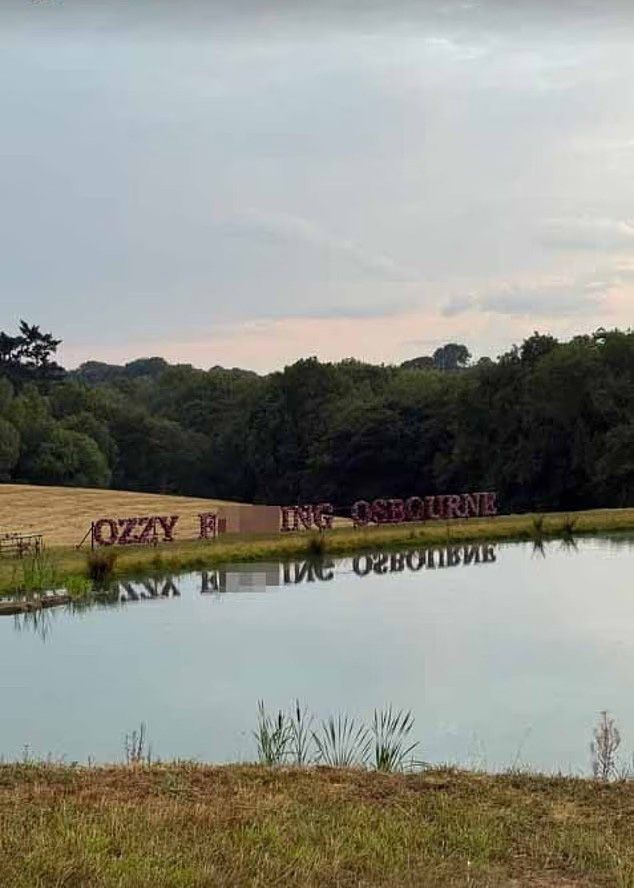 large floral wreath for ozzy osbourne near lake at buckinghamshire home