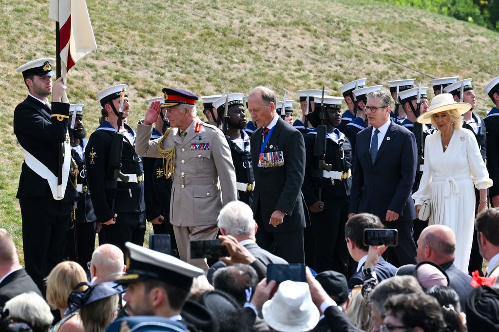 King Charles III, Royal British Legion National President Vice Admiral Paul Bennett, Britain's Prime Minister Keir Starmer and Queen Camilla attend a Service of Remembranc