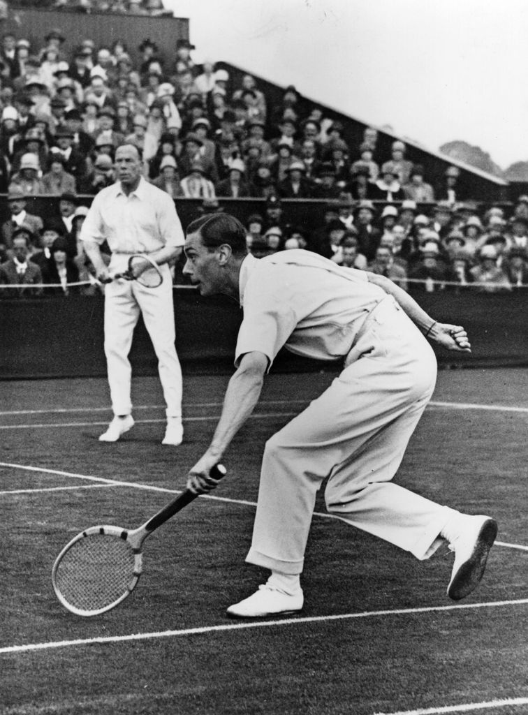 King George VI playing in a doubles match at Wimbledon