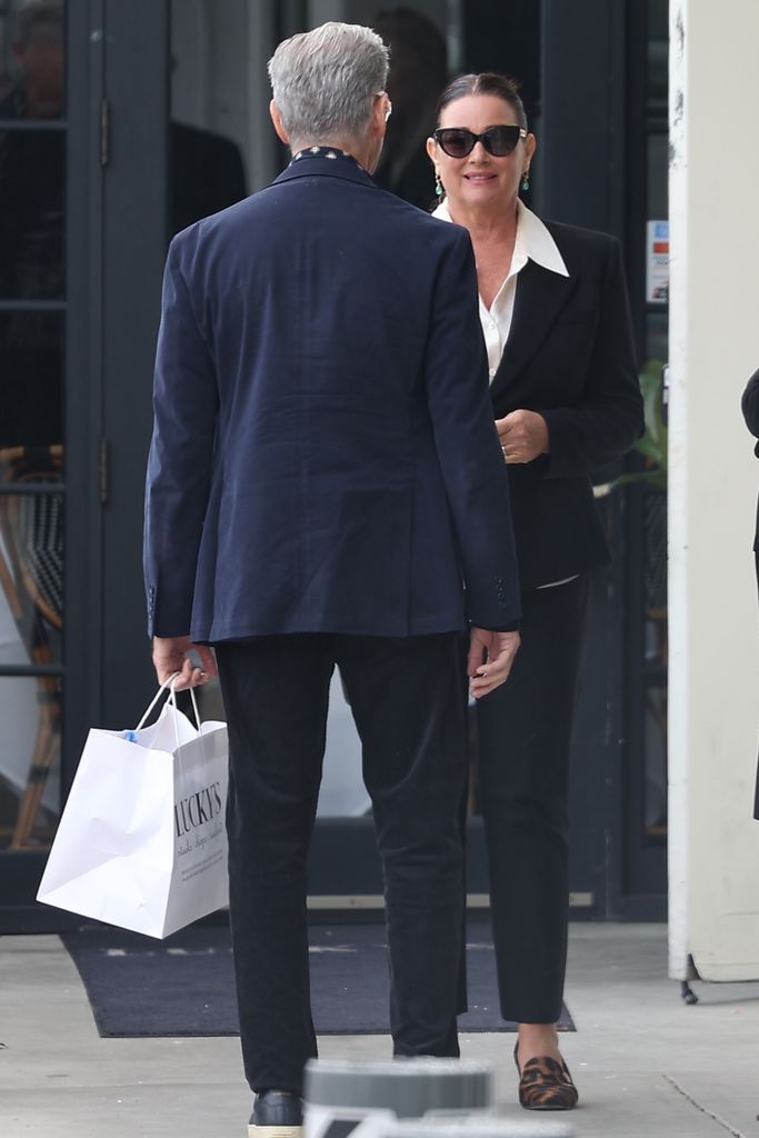 Pierce Brosnan chats to his suit-clad wife Keely during a lunch date in Malibu