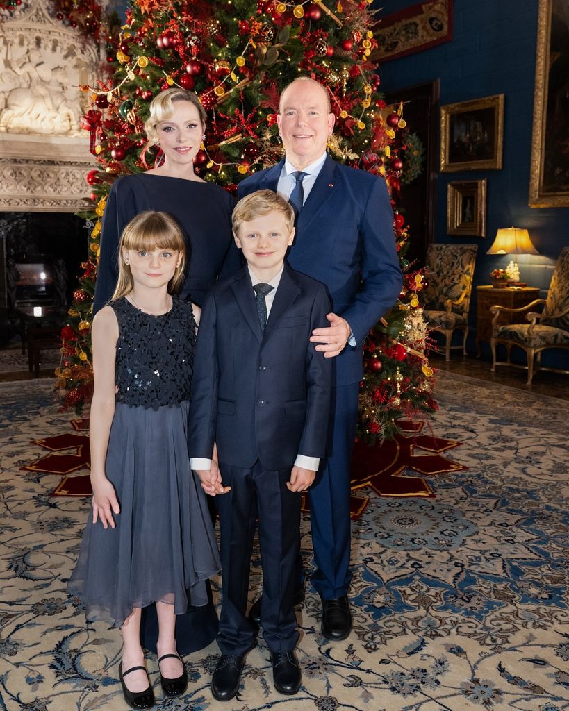 Princess Charlene with albert and kids in front of christmas tree