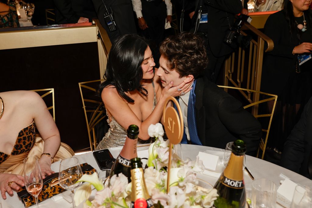 Kylie Jenner and Timothée Chalamet kissing at the 2025 golden globes