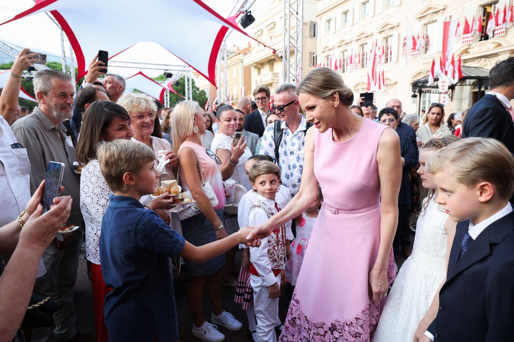 Charlene of Monaco greets people near daughter and twin Jacques
