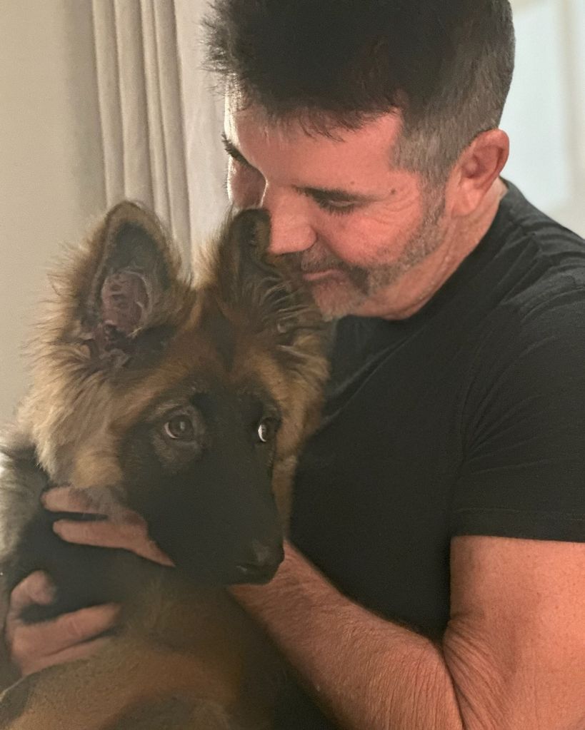 A photo of Simon Cowell and his dog Pebbles