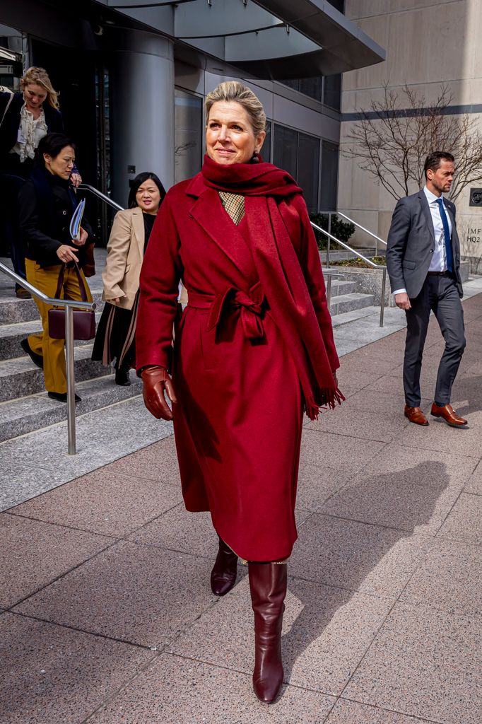 Queen Maxima on street in red coat