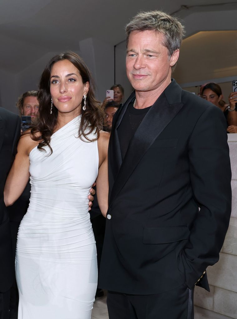 Ines de Ramon and Brad Pitt attend the "Wolfs" red carpet during the 81st Venice International Film Festival 